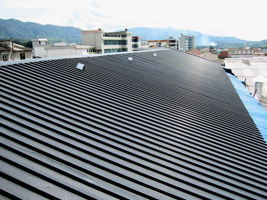 Close up of perforated solar panels on moyu plant roof