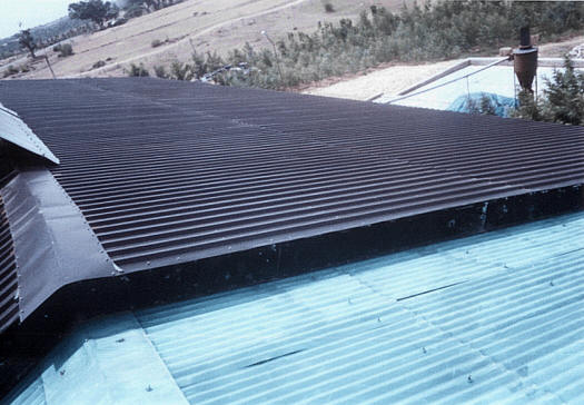 Perforated solar panels mounted on the roof.